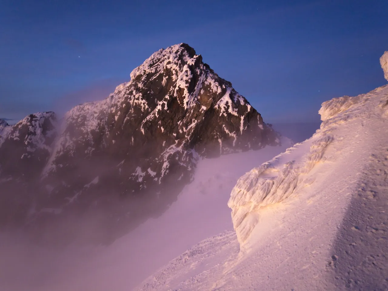 Snow and rime ice on Alexandra Peak in the glaciated Mount Stanley massif, Rwenzori Mountains, at dawn